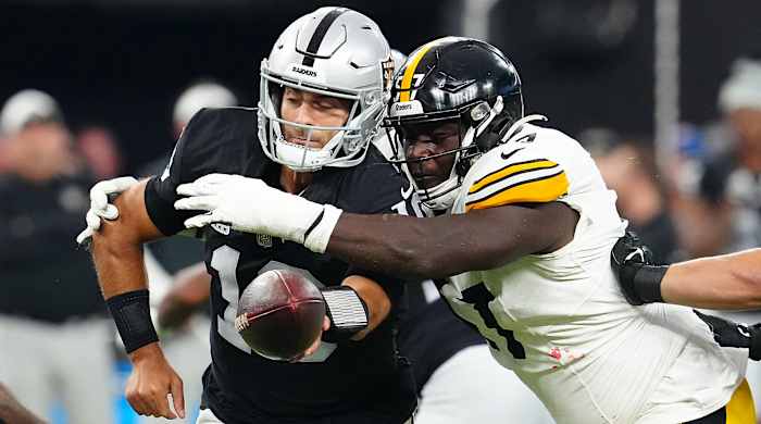 Steelers defensive tackle Montravius Adams pressures Raiders quarterback Jimmy Garoppolo as he tries to hand off the ball